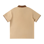 Norman Prince tan short sleeve polo shirt with brown collar and sleeve trim, cotton blend.