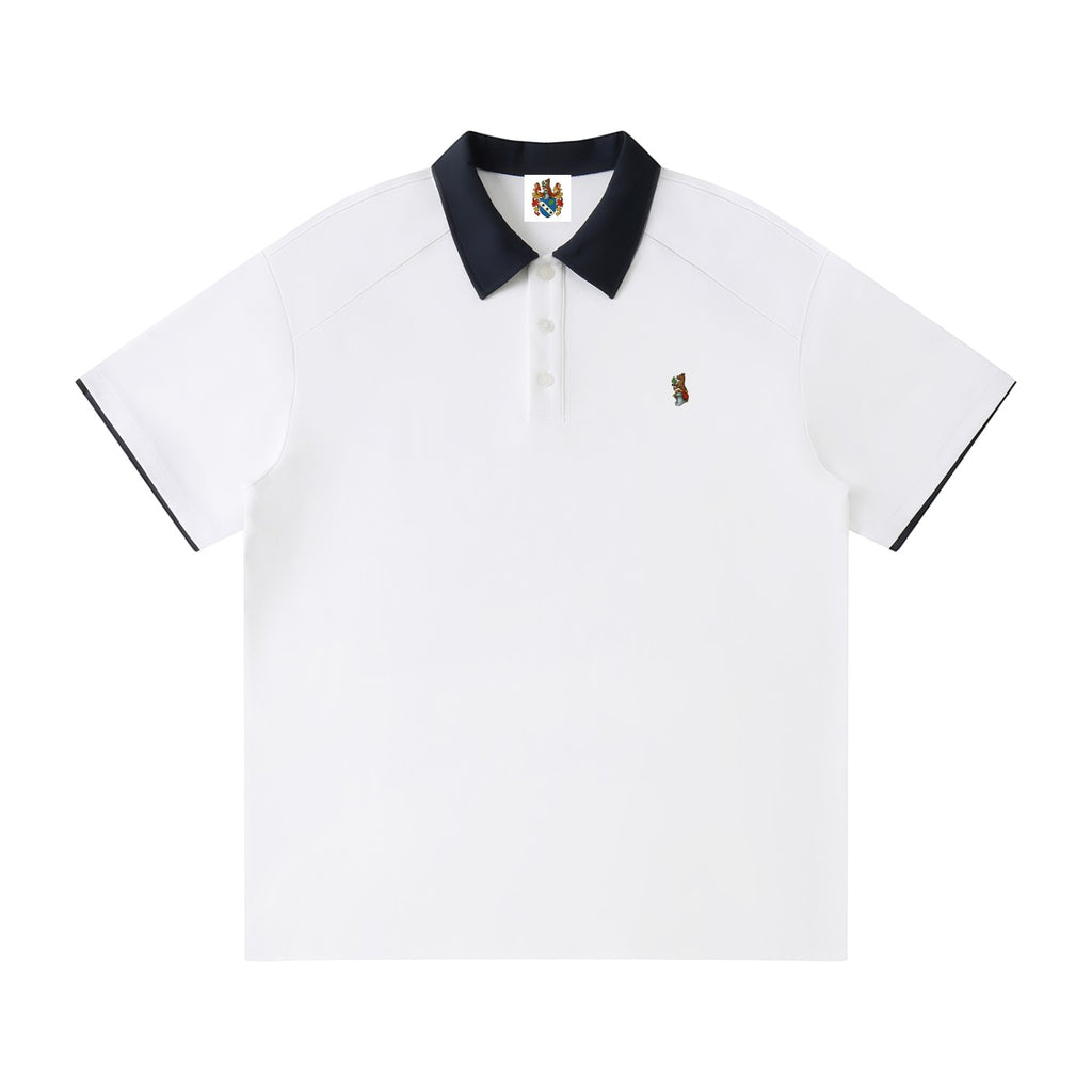 Norman Prince white cotton blend short sleeve polo shirt with navy collar and sleeve trim, featuring a small embroidered logo.